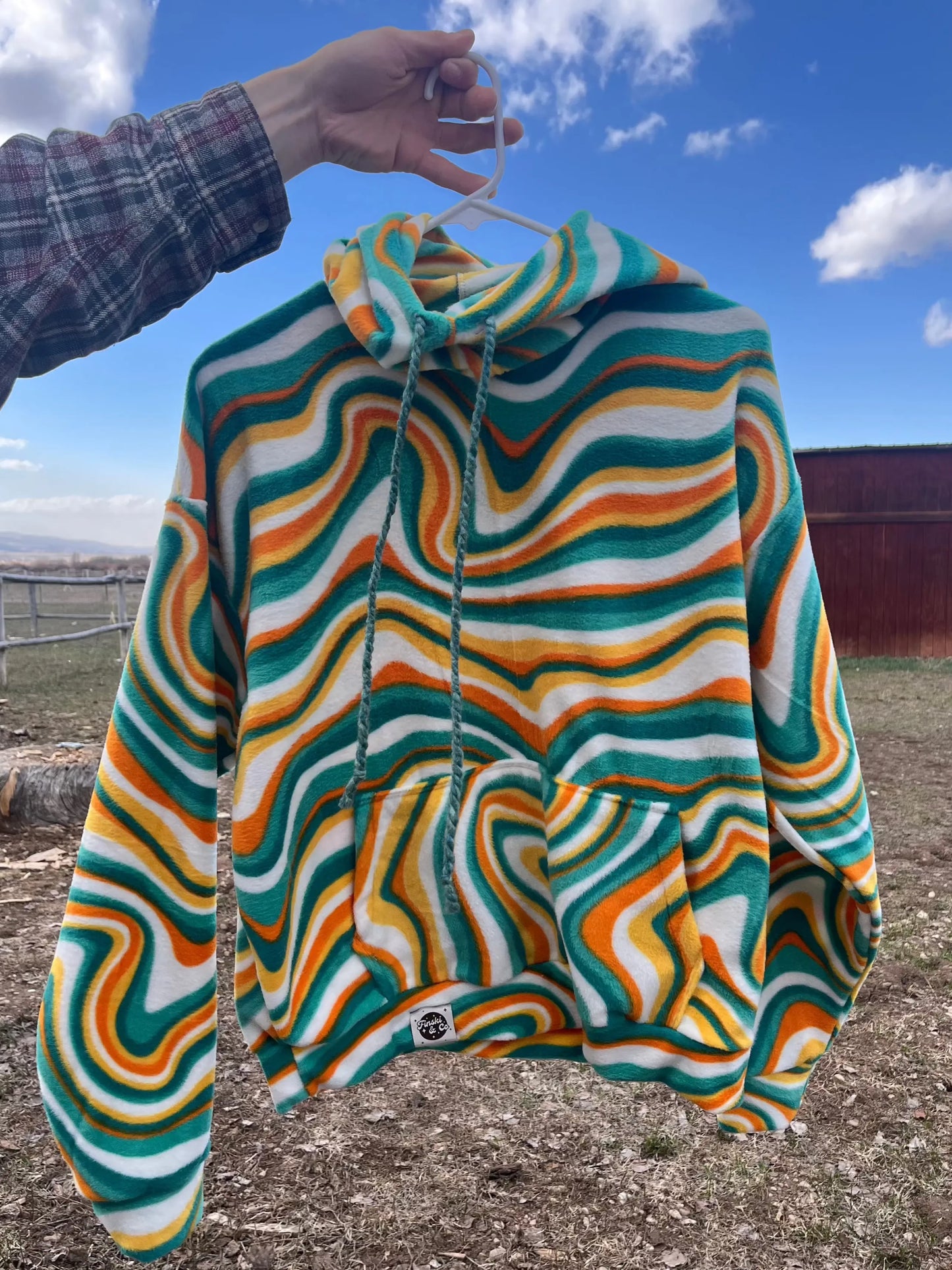 Handmade fleece hoodie with colorful psychedelic waves. Cozy pullover for skiing, camping, river trips.