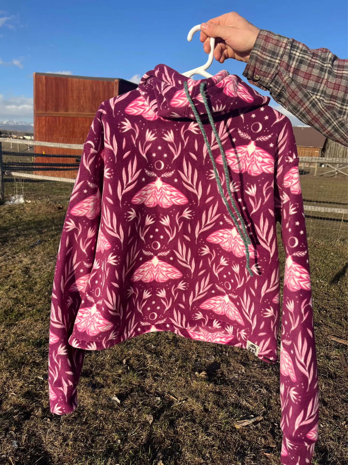 Handmade cropped fleece hoodie with a pink moth flower pattern. Cozy pullover for skiing, camping, river trips, every day casual wear.